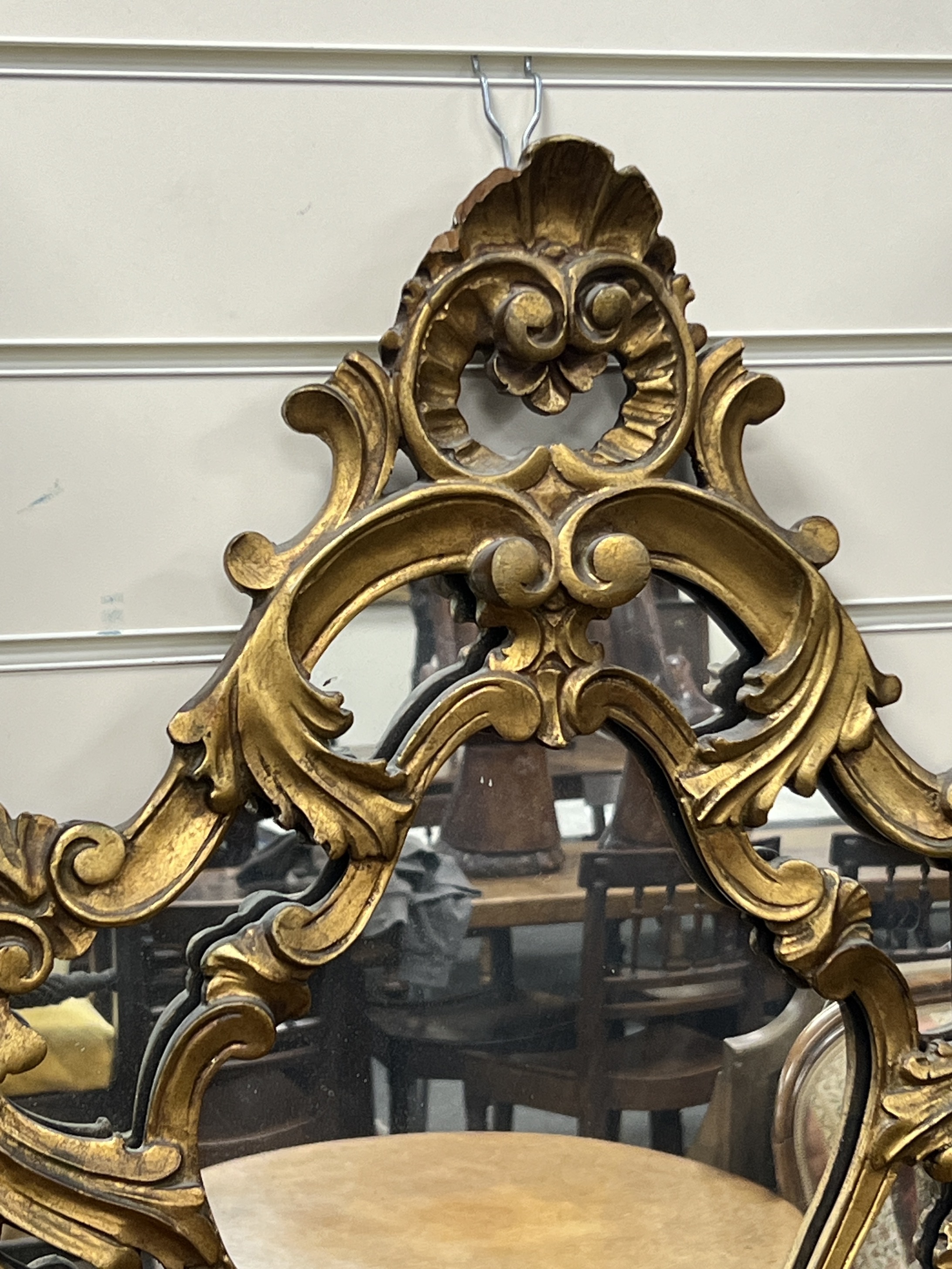 An 18th century style carved wood cartouche wall mirror, width 49cm, height 76cm